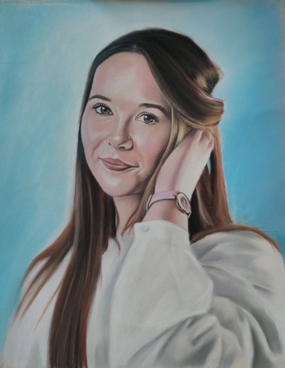 Soft pastel colour portrait of a young woman against a blue background